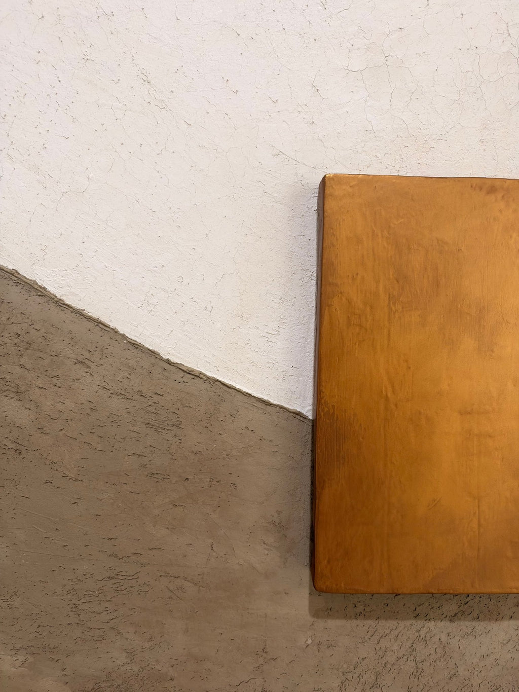 KR 05 Drought handmade plaster wall art, close-up of the bronze-and-gold wax block against crackled cream and taupe plaster | ACAYA Studio