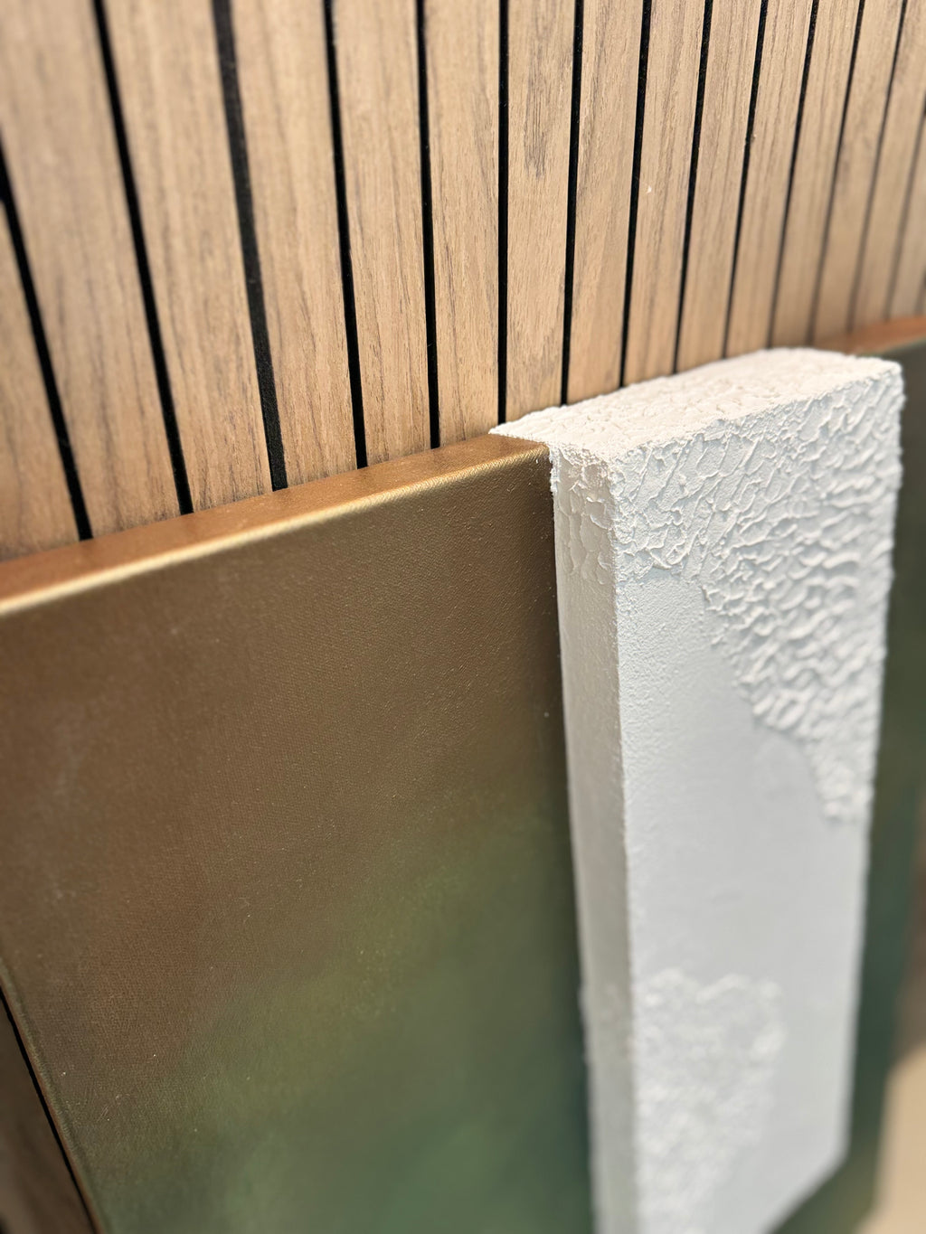 TS 02 Canopy, detail view — moss, olive, and earthy green field paired with a raised plaster plane | ACAYA Studio Tsitsikamma collection