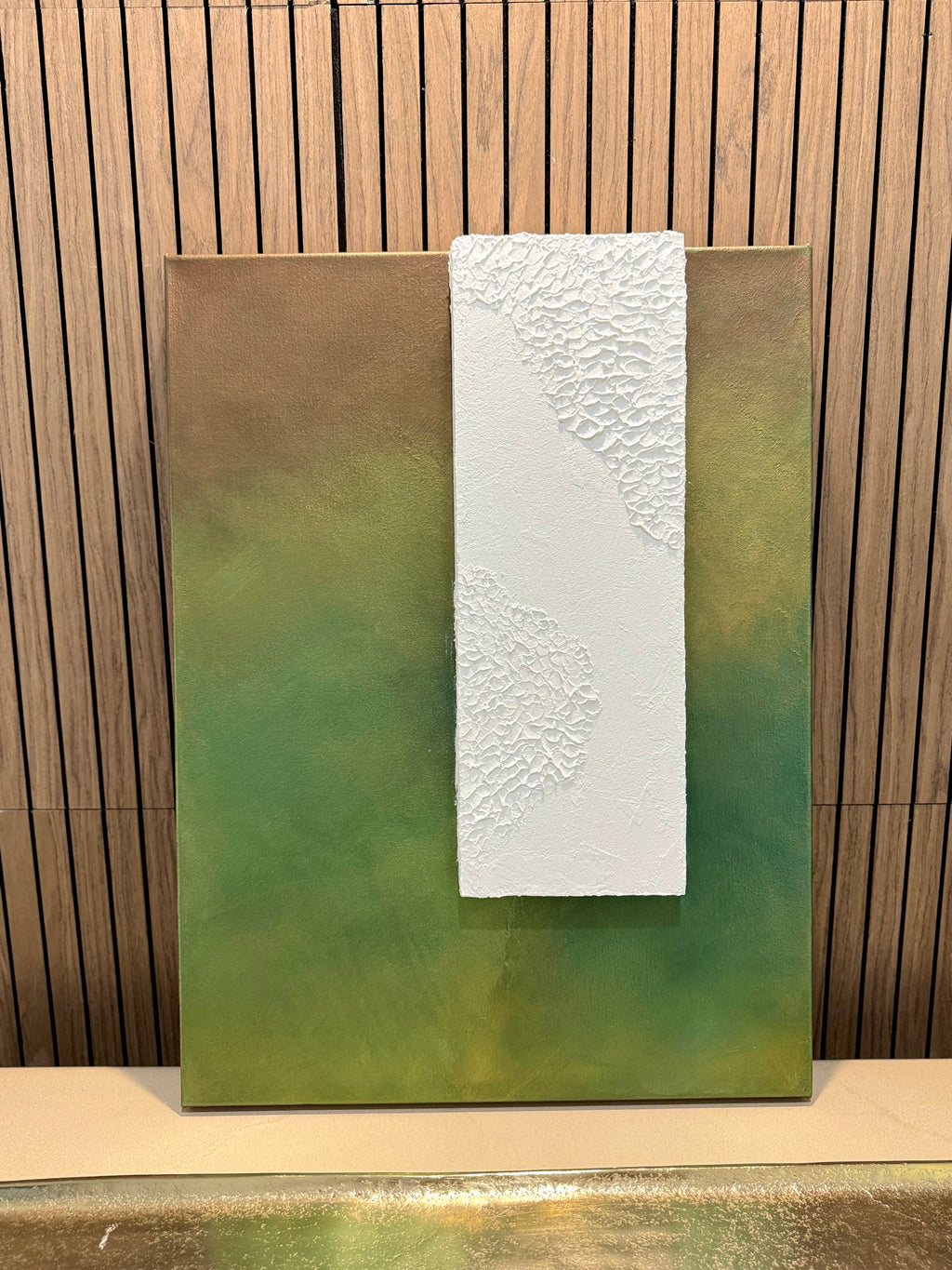 TS 02 Canopy, alternate angle — moss, olive, and earthy green field paired with a raised plaster plane | ACAYA Studio Tsitsikamma collection