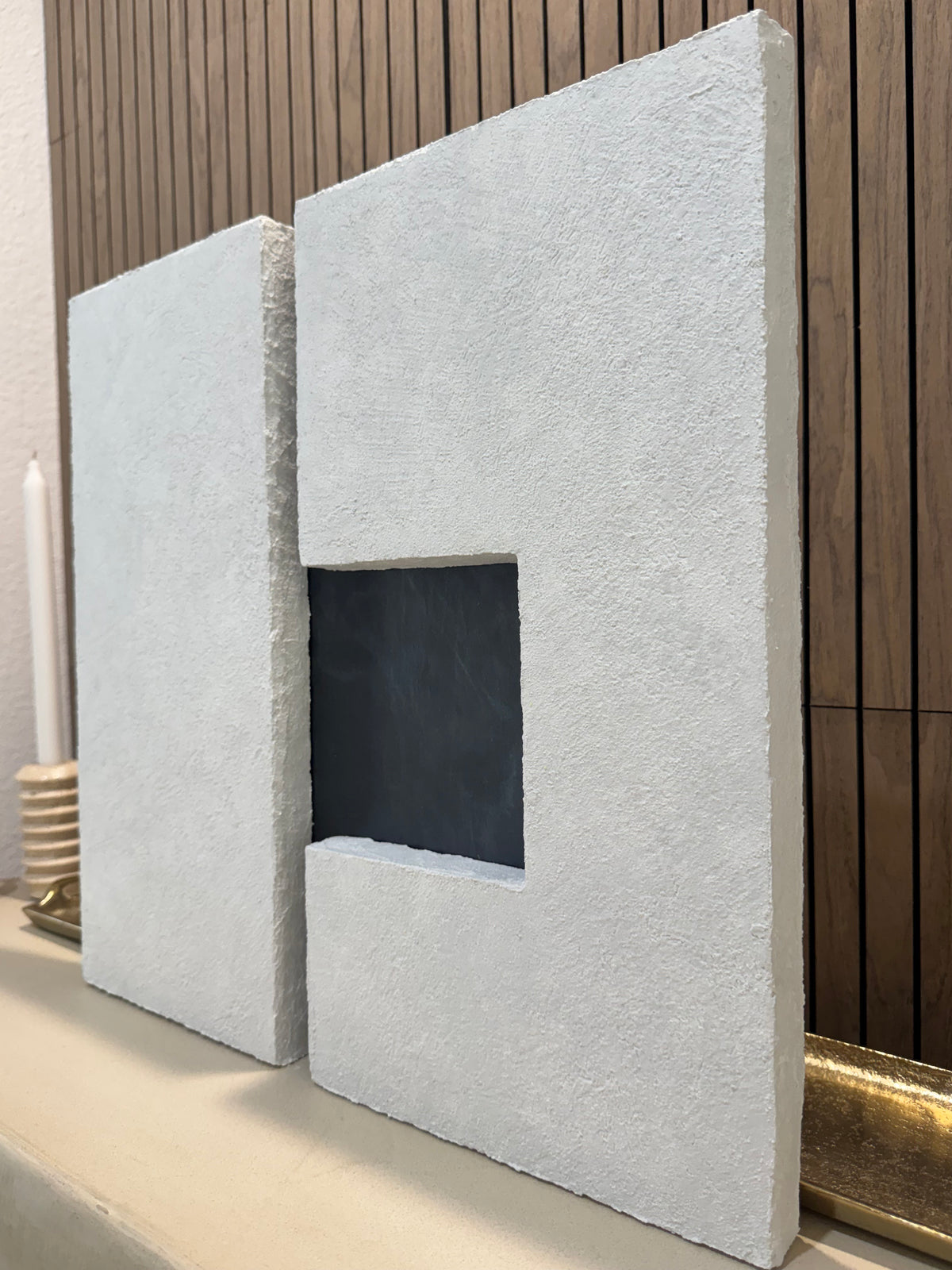 TS 03 Current, alternate angle — two pale stone planes separated by a recessed gunmetal passage | ACAYA Studio Tsitsikamma collection