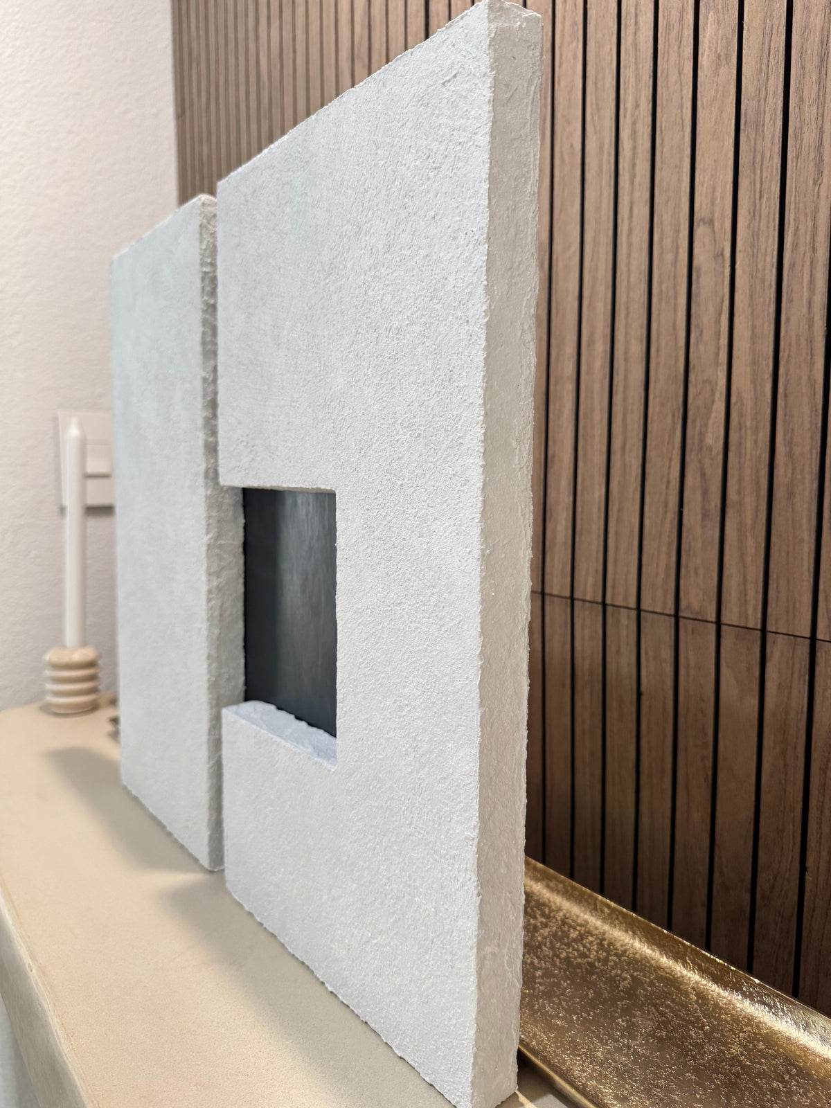 TS 03 Current, detail view — two pale stone planes separated by a recessed gunmetal passage | ACAYA Studio Tsitsikamma collection