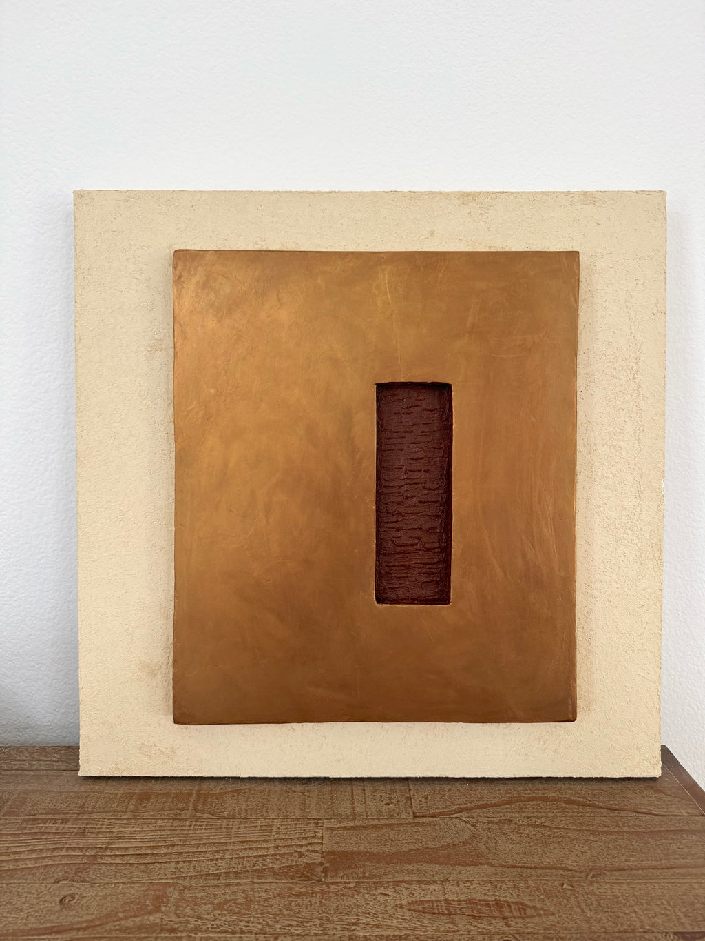 KR 04 Hearth, alternate angle — raised bronze plane with a recessed oxblood-red void | ACAYA Studio Kruger collection