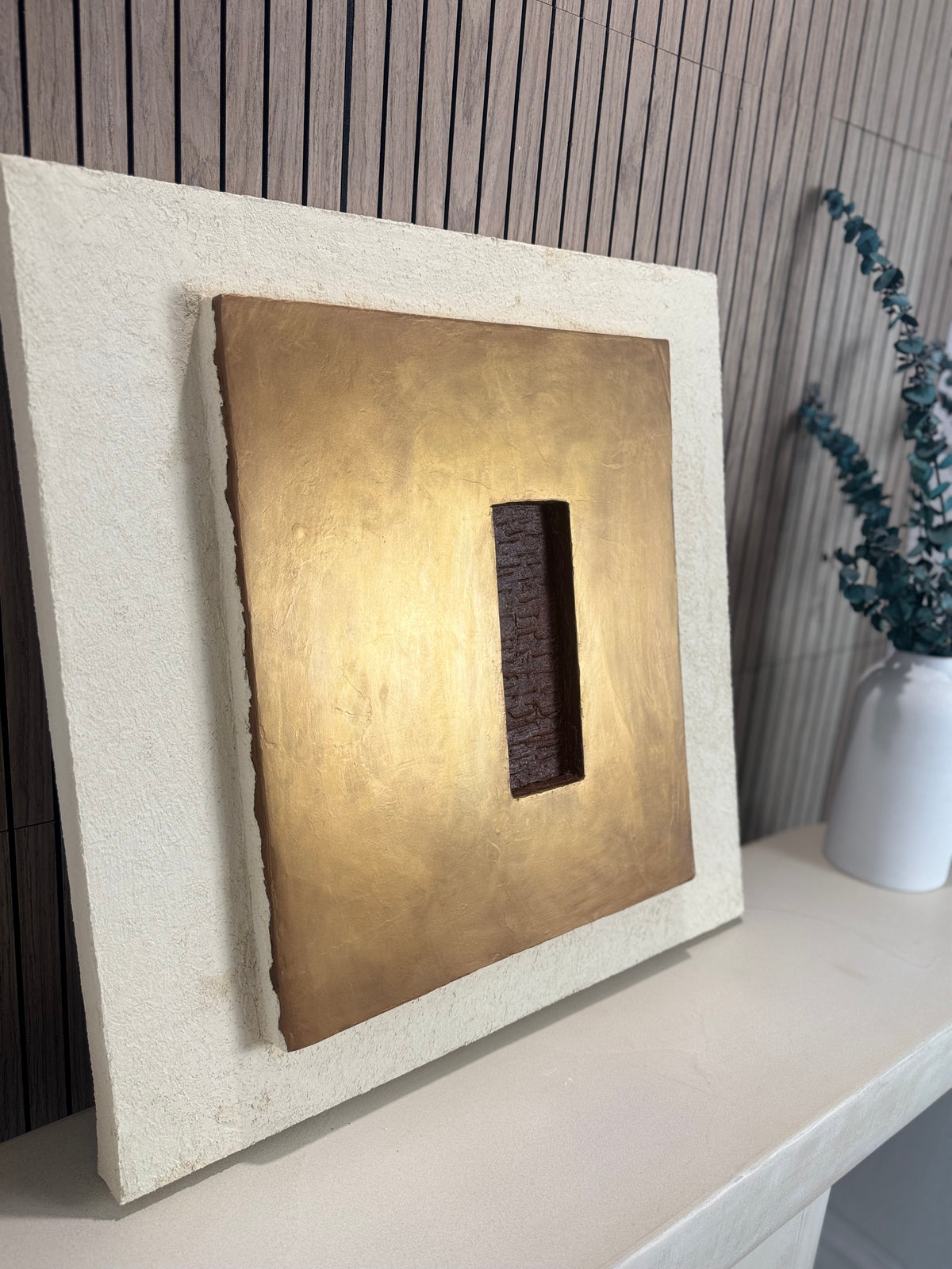 KR 04 Hearth, detail view — raised bronze plane with a recessed oxblood-red void | ACAYA Studio Kruger collection