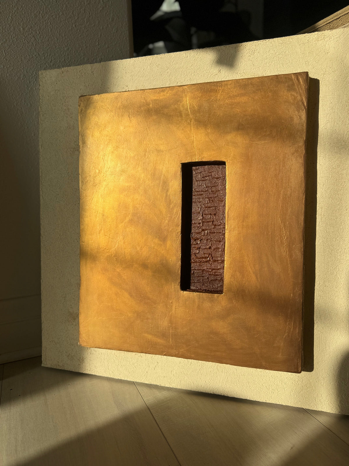 KR 04 Hearth, detail view — raised bronze plane with a recessed oxblood-red void | ACAYA Studio Kruger collection