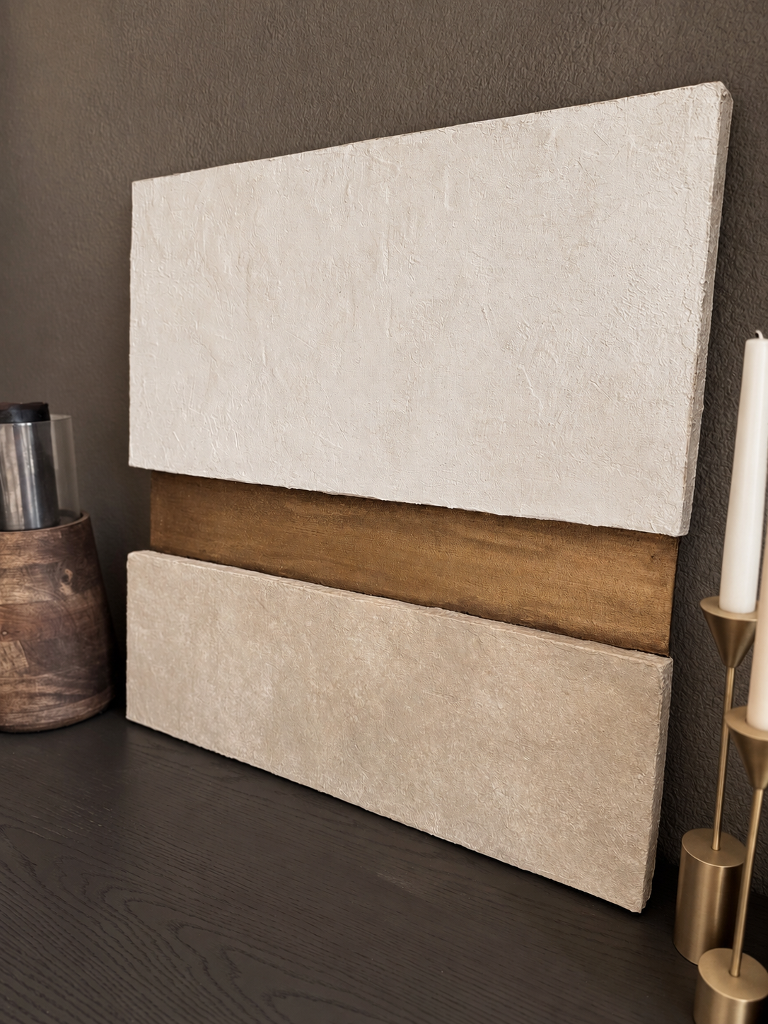 KR 03 Strata, detail view — pale and taupe plaster planes stacked around a recessed gold-and-bronze band | ACAYA Studio Kruger collection