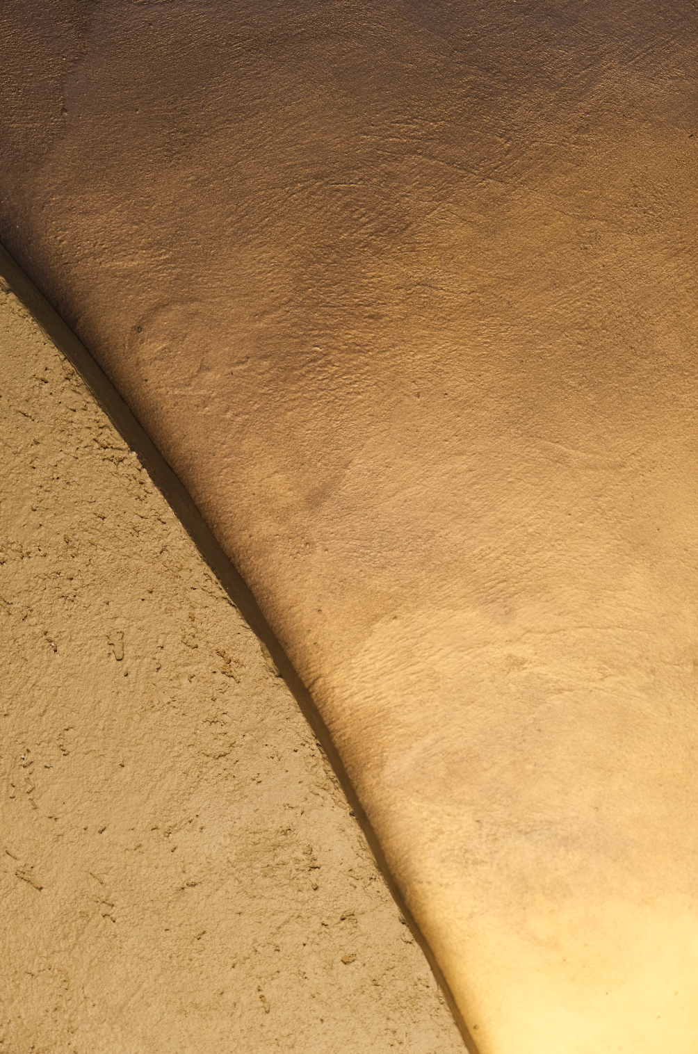 KR 02 Kloof, styled in room — sculpted mineral surfaces parting to reveal a warm metallic passage | ACAYA Studio Kruger collection